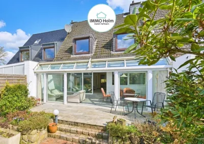 Großzügiges Reihenmittelhaus mit schönem Wintergarten in Holm! · Holm