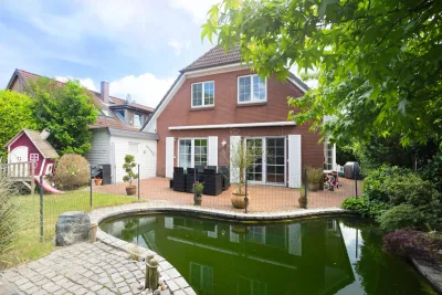 Ansicht · Ihr Traumhaus in Hetlingen: Wohnen mit Stil, Komfort und Badespaß · Bild 6 von 30 · IMMO Holm