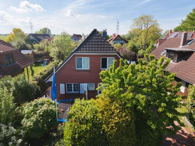 Ansicht · Ihr Traumhaus in Hetlingen: Wohnen mit Stil, Komfort und Badespaß · Bild 13 von 30 · IMMO Holm