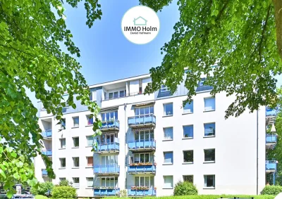 Ruhige Wohnstraße, beste Anbindung. Blick in die Baumkronen. · Titelbild · IMMO Holm