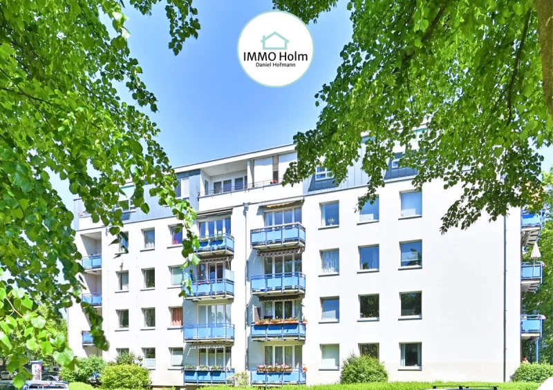 Ruhige Wohnstraße, beste Anbindung. Blick in die Baumkronen. · Titelbild · IMMO Holm