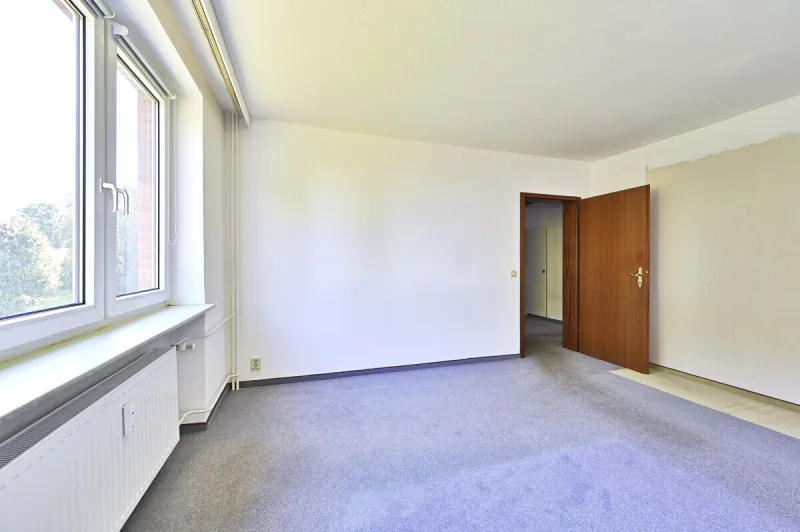 Ansicht · Charmante 3-Zimmer-Wohnung - Südbalkon, Garage & Platz für Ideen · Bild 12 von 18 · IMMO Holm